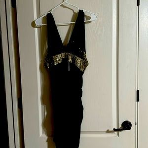 Mini black and gold dress size M never worn. Great condition